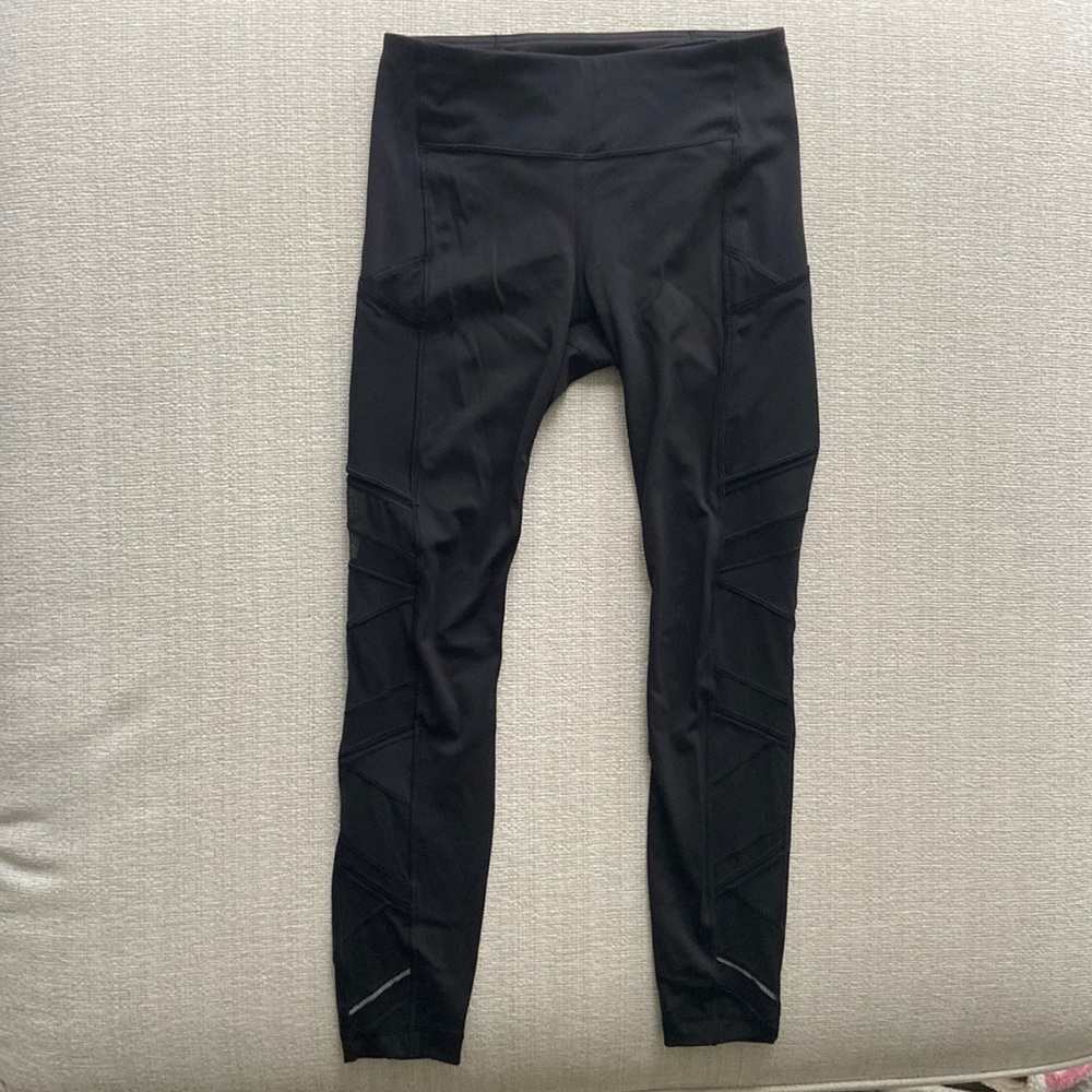 Lululemon black leggings with sheer side panels. EUC size 6